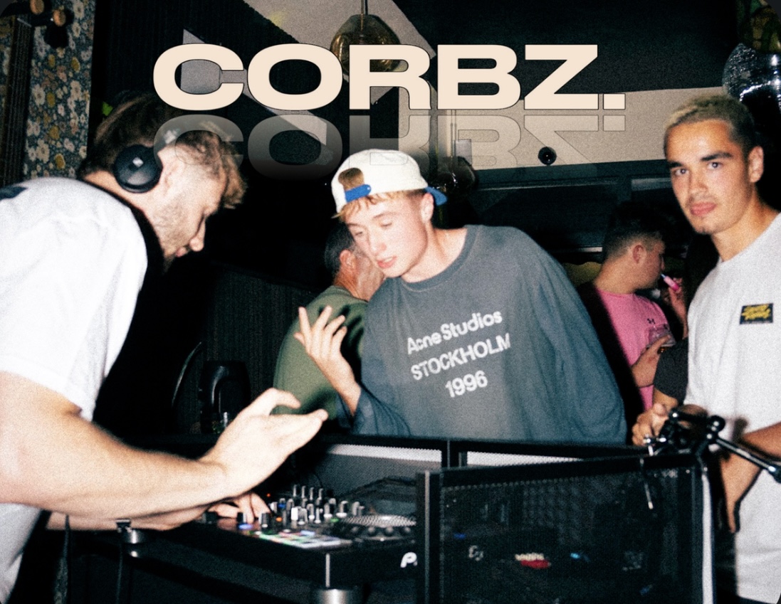 CORBZ. behind the decks with a packed booth